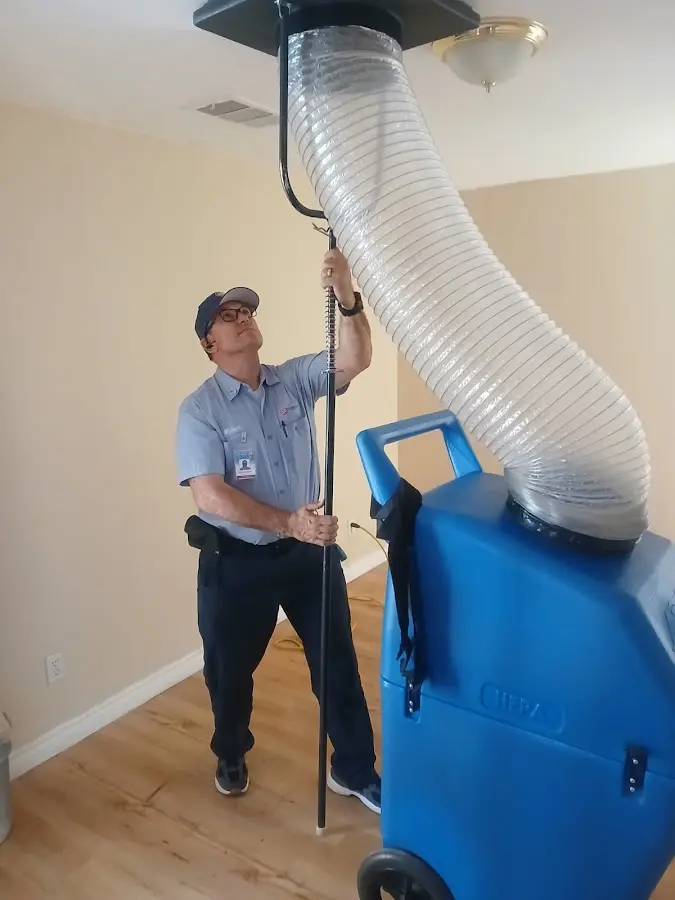Furnace Tune-Up technician using HEPA equipment in Ocean Pines